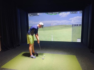 playing golf simulator